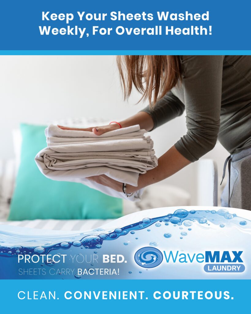 Folding freshly washed flannel bedding, WaveMAX Laundry Wyoming MI