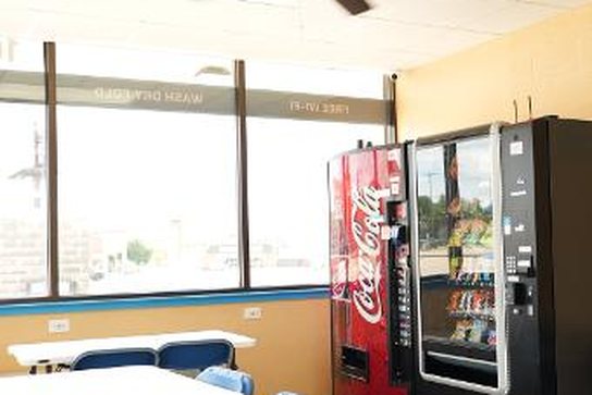 Seating and vending area at the Olaf Drive laundromat in Temple, TX