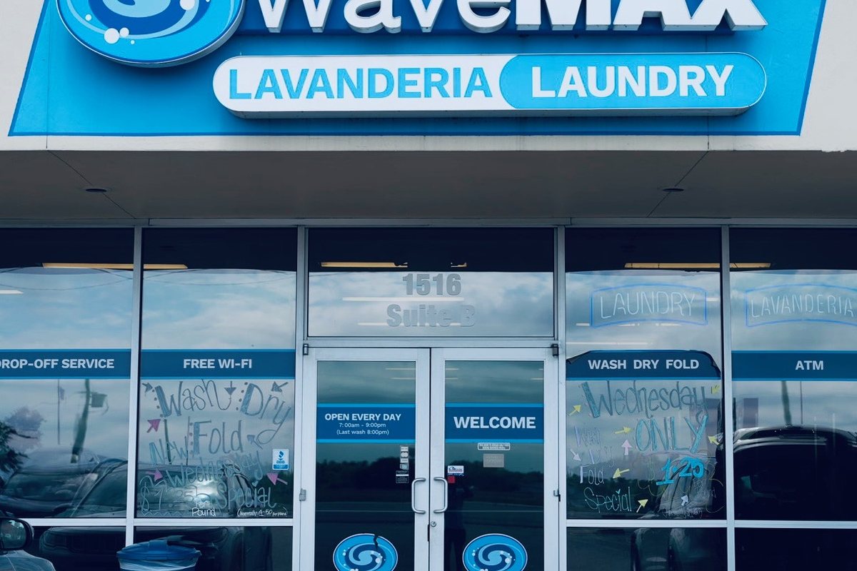 Storefront and sign at WaveMAX Laundry Temple, TX