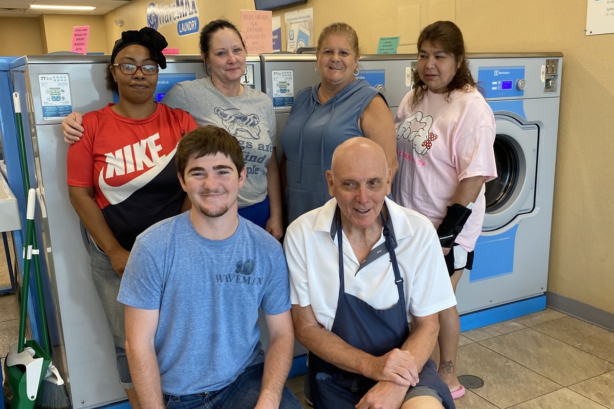 WaveMAX Temple, TX — S 31st St B | WaveMAX Laundry 17 Customers using the folding tables at the Temple, TX laundromat